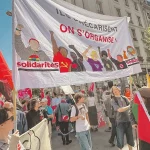 Une banderole de solidaritéS lors du cortège du 1er Mai à Genève